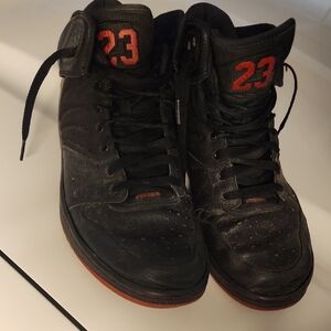 Nike Air Jordan 1 Flight 4 Premium sneakers in black with red accents.